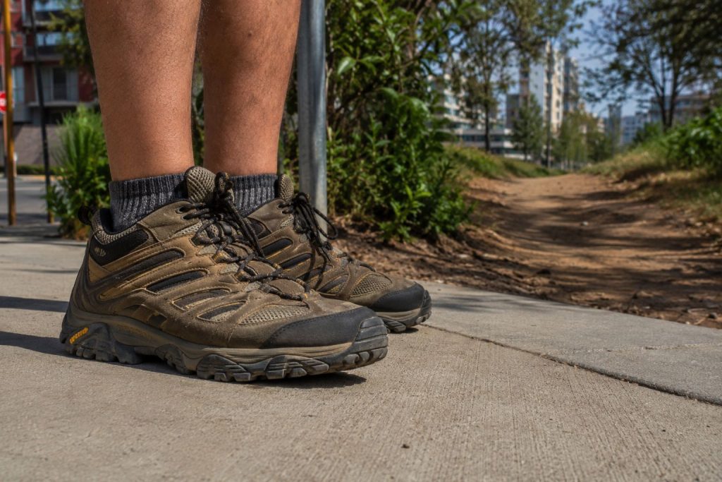 a hiker's feet wearing rugged hiking shoes
